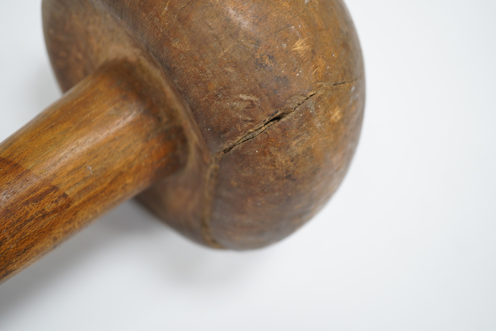 A Sudanese wooden Knobkerrie, approximately 62cm long, with profoundly swollen mushroom shaped head. Condition - poor to fair